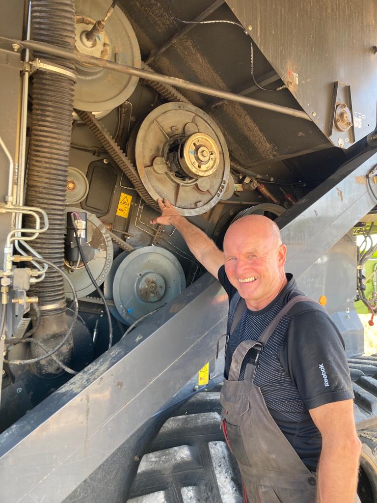 Paul King working on a combine harvester