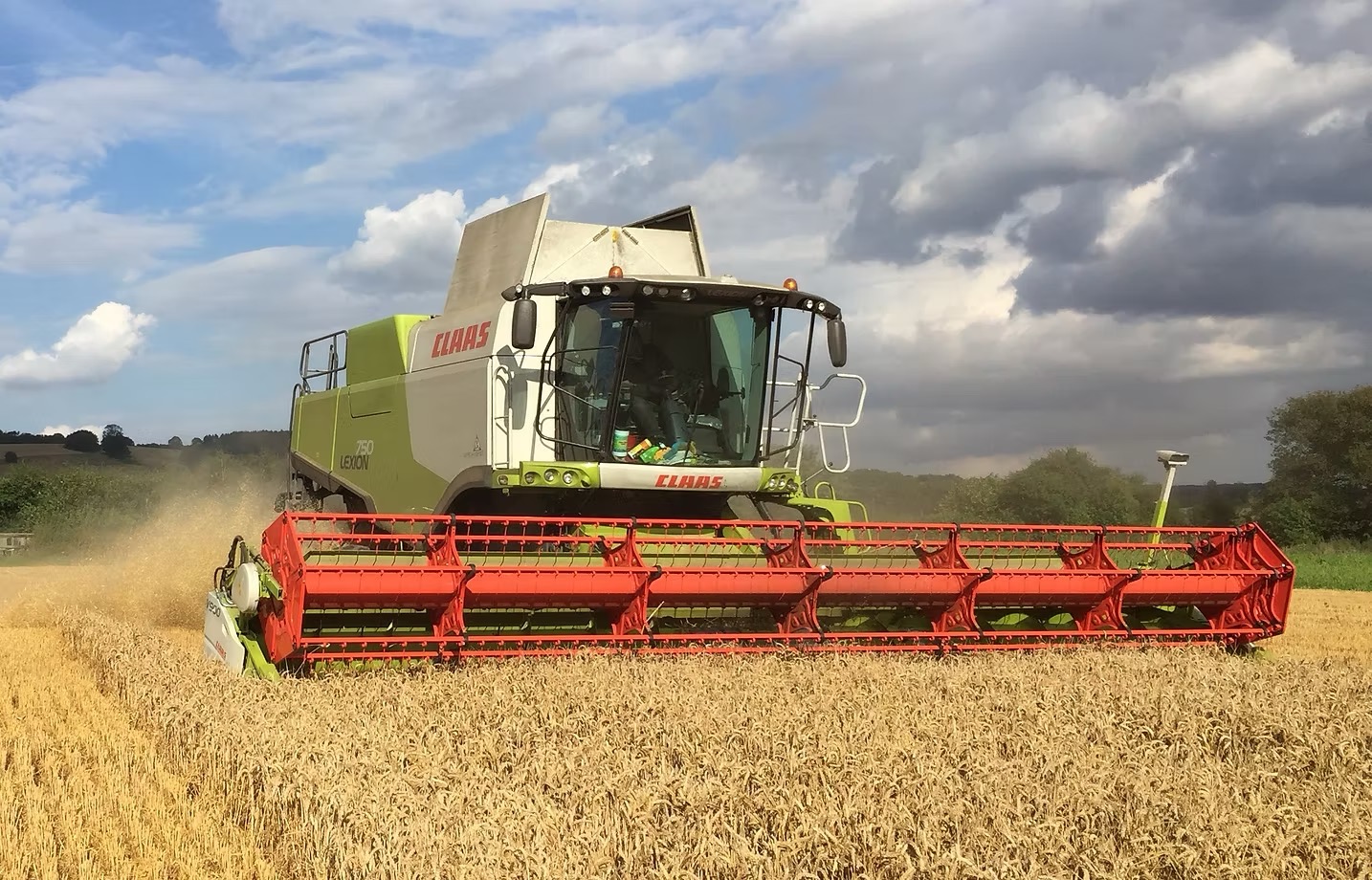 CLAAS Lexion 750 combine harvesting a field of wheat